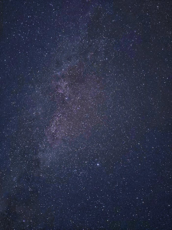 Capture the beauty of the Milky Way galaxy across the night sky, filled with countless stars.