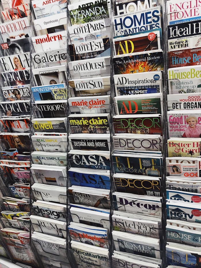 A vibrant display of assorted magazines on a stand in a New York City market.